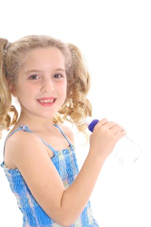 happy little girl drinking waterの写真素材
