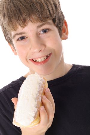young boy eating a doughnutの写真素材