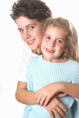 brother & sister hug verticalの写真素材