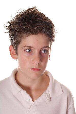 young boy giving serious lookの写真素材