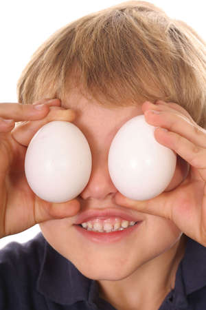 little boy with egg eyes verticalの写真素材