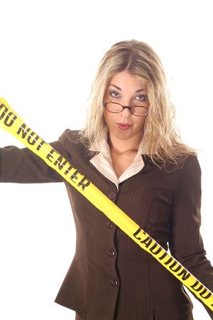 Woman with glasses holding do not enter tapeの写真素材