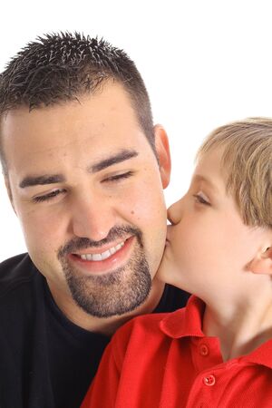 child kissing dad on the cheekの写真素材