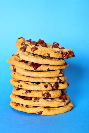 chocolate chip cookie stack on blue verticalの写真素材