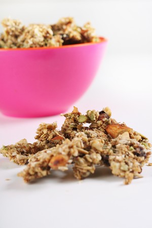 gourmet granola in pink bowl verticalの写真素材