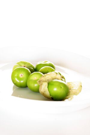 tomatillos on white verticalの写真素材