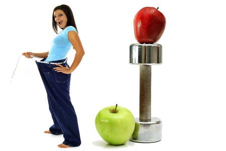 weight loss workout apples brunette in jeansの写真素材