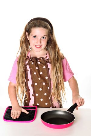 little chef with apron ready to cookの写真素材