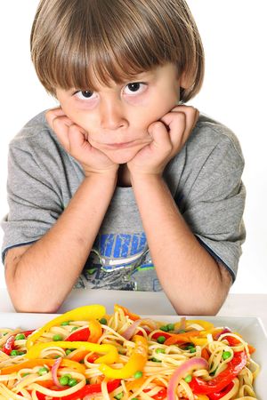 child with veggie pastaの写真素材