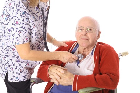 nurse checking elderly mans pulseの写真素材