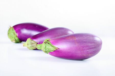 fresh from the garden eggplant on whiteの写真素材