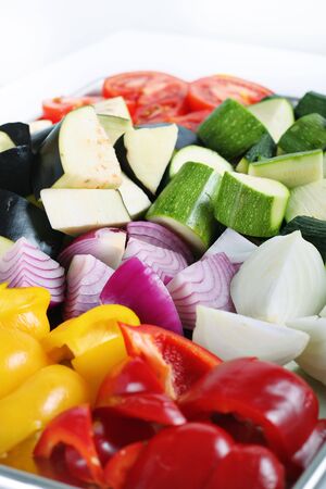 peppers eggplant onions & zuchinni on whiteの写真素材