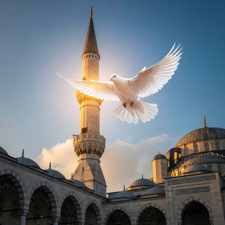 Serene scene of a white dove in flight above a mosque's intricate stone architecture and domes at...