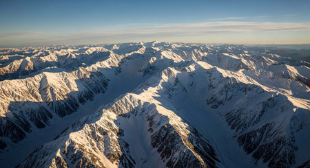 Aerial view of the snow-capped peaks of the mountain range.の写真素材