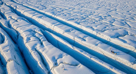 Snowy landscape with deep crevasses and blue shadows, aerial perspective, rugged terrain