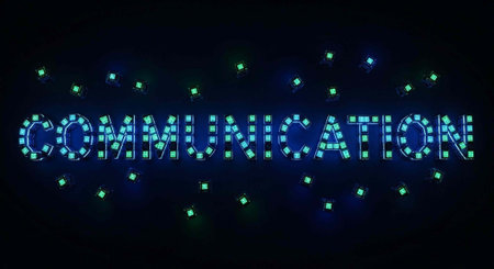A bright blue communication sign made of small squares surrounded by green lights on a dark...