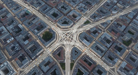 Aerial view of a complex urban highway interchange in a densely populated city