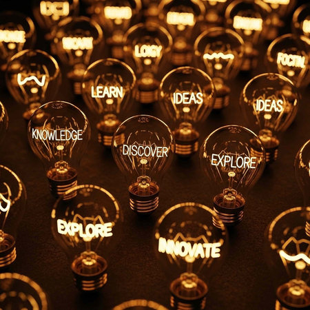 A collection of illuminated light bulbs with inspirational words like discover, explore, and innovate