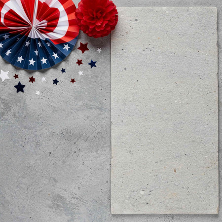 top view of american flag on grey concrete background with copy space