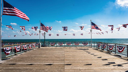Pier with flags of the United States of America on a sunny day