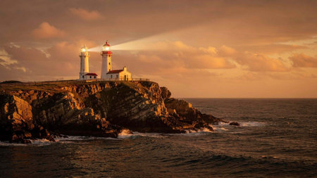 Lighthouse on the Atlantic Ocean at sunset in Portugal, Cabo da Roca