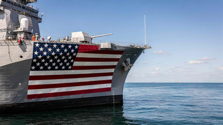 Military ship with the American flag painted on its side, showcasing national pride and maritime defense.