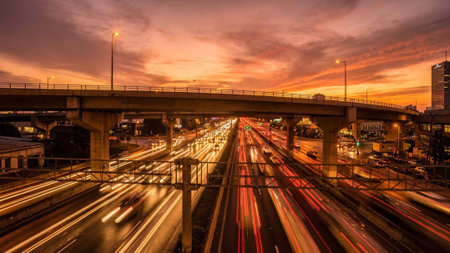 Traffic on the highway at sunset, in Bangkok, Thailand.