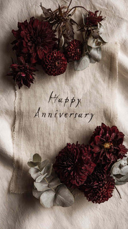 Dahlias and eucalyptus branches on a linen tablecloth