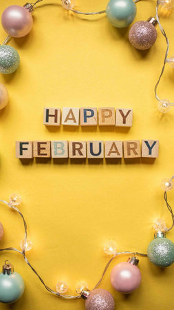 Happy february alphabet letters on yellow background with Christmas ornaments