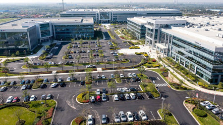 Aerial view of a parking lot with cars parked in the city