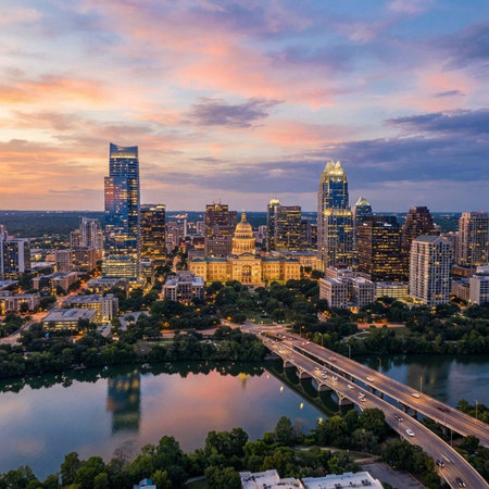 Aerial view of a city skyline at sunset