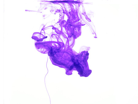 Abstract form of purple color in water, isolated on white background.の写真素材