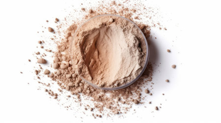 Cocoa powder in a bowl isolated on white background, top viewの素材