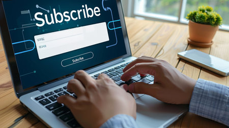 Subscribe button on laptop screen. Internet and social media marketing concept.の素材