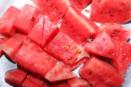 Slices of watermelon pattern textured red background.の写真素材