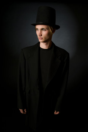 Portrait of young male performing artist in retro 19th century style fashionの写真素材
