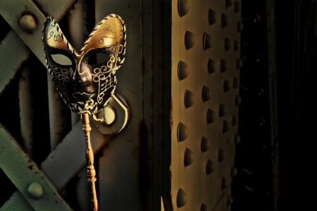Masquerade - Venetian Mask on Vintage Bridgeの写真素材