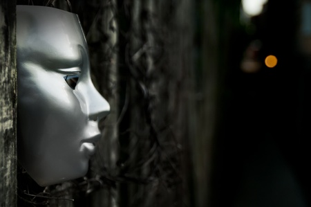 Trapped - Mask on Weathered Fenceの写真素材