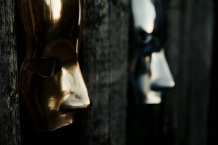 Trapped - Masks behind Weathered Fenceの写真素材