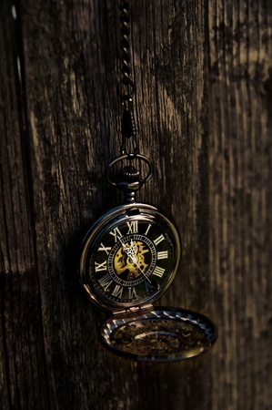 Time - Vintage Pocket Watch on Weathered Wood Backgroundの写真素材