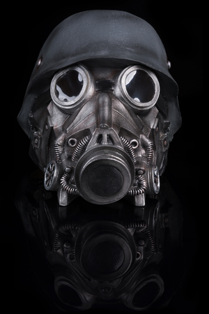 Military Helmet with Goggles and Gas Mask isolated on Black Backgroundの写真素材