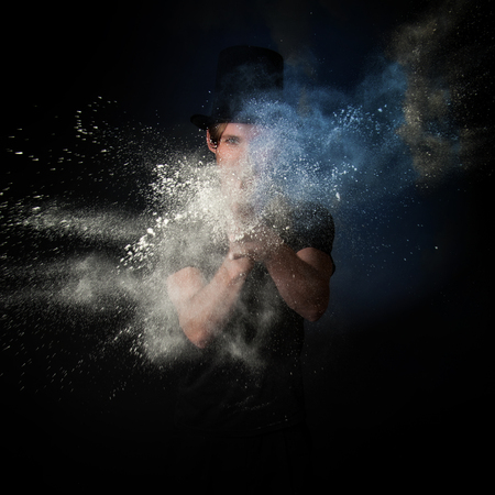 Young Magician playing with Magic Powderの写真素材