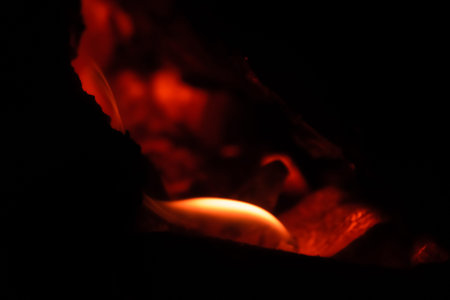 Flaming charcoal burning in the camp fire