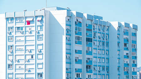 Modern and new residential apartment building. Complex Multistoried modern, new and stylish living block of flats and turkish flag.の写真素材