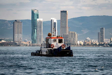 Izmir, Turkey-01.06.2021: Municipal boat serving to clean the sea in mansion izmir turkeyの写真素材