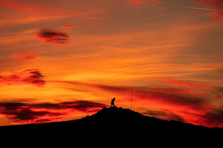 Ataturk silhouette. Climb the mountain with a magnificent cloudy sky sunset.の写真素材