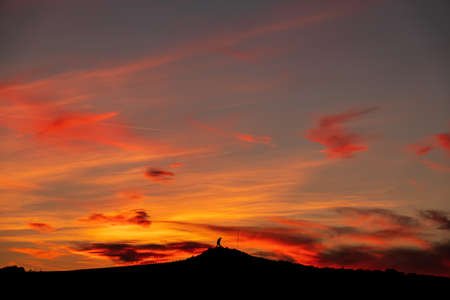 Ataturk silhouette. Climb the mountain with a magnificent cloudy sky sunset.の写真素材