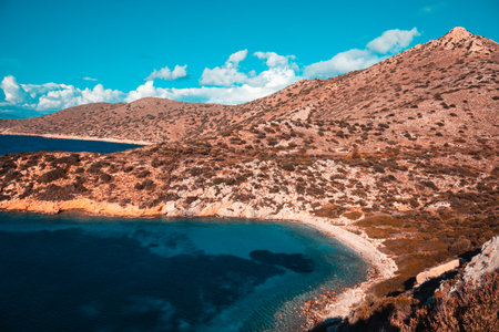 Beautiful coastal landscape with rocky shoreline and clear turquoise waters.の写真素材