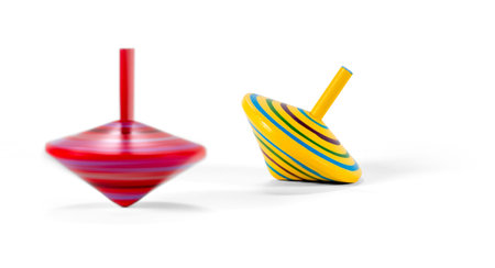 Two wooden and colorful spinning tops