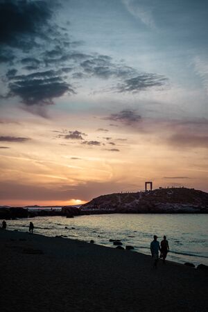 Breathtaking view of beach, mountains of Naxos island at sunset with Lygdamis in the backgroud, Cyclades archipelago, Greece - Imageの写真素材